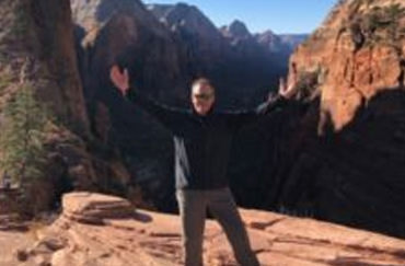 Employee standing on mountain
